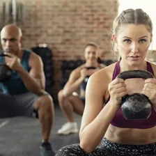 Woman doing kettlebell training at the gym